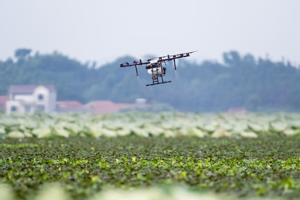 Freestone Strategies Technology Expertise Drone Spraying Crops On A Farm